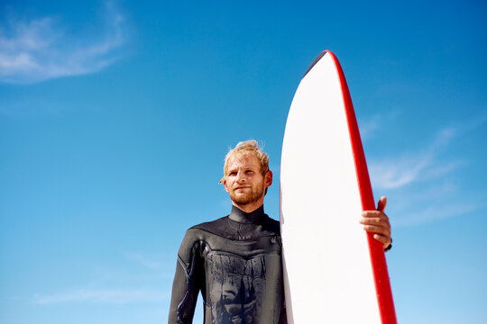 Man holding a surfboard
