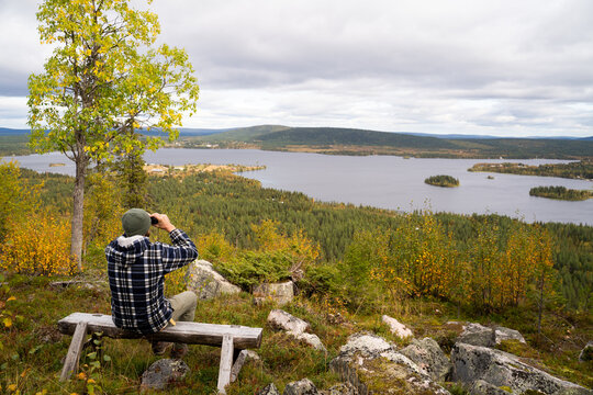 Man with binoculars in nature