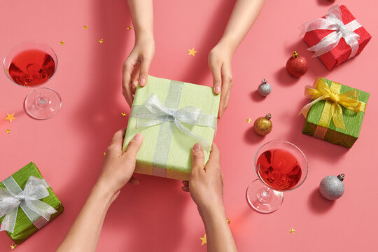 Gives a gift Christmas presents laid on a color decoration