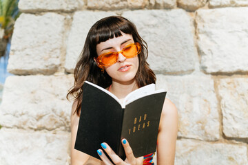 Fun colorful woman holding a notebook of ideas