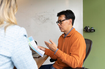 Young Professional in Job interview with resume