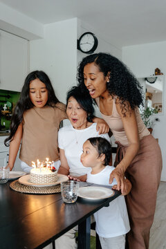 Grandmother celebrating birthday with family