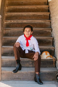Charro teen boy on Wooden Staircase