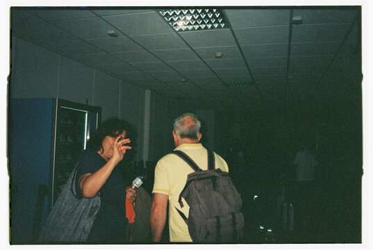 Waving goodbye at the airport terminal