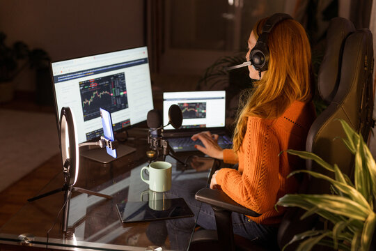 redhead streamer girl putting on her headphones