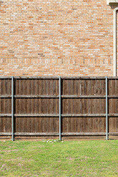 A view of brick, wood, and grass textures, in one