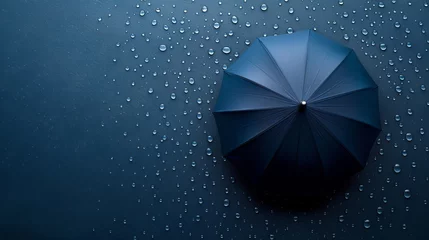 Fotobehang Umbrella providing shelter from raindrops with space for text placement in rainy weather concept © Ilja