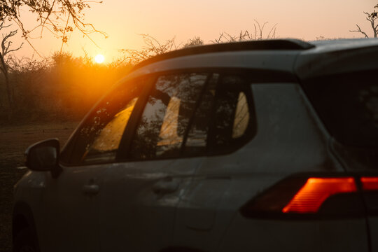 Sunset or sunrise with car and copy space