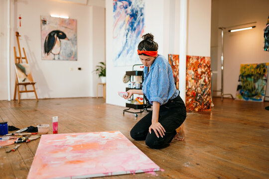 The artist works indoors