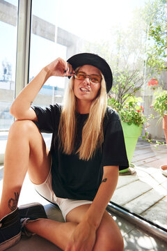 Blonde woman winking at the camera.
