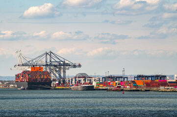 Manhattan port with colorful shipping containers and cranes