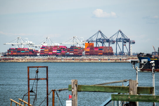 Manhattan port with colorful shipping containers and cranes