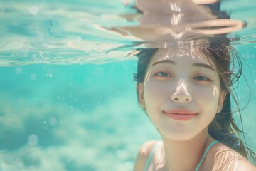 水着で海の中で遊ぶ日本人女性（シュノーケル・水泳・海水浴） - obrazy, fototapety, plakaty
