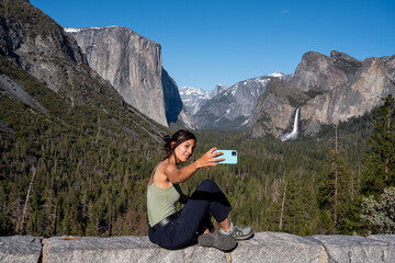 Hiker Taking Photo With mobile In Yosemite Valley
