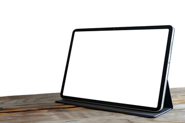 The tablet computer stands on the table with a blank white screen and transparent background. Screen display for mockup.
