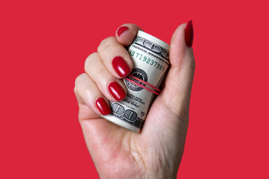 Hand holding money
