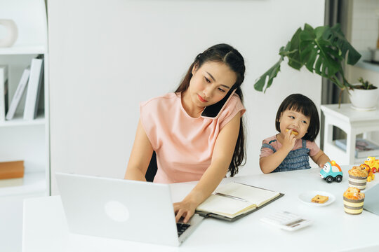 Family Business. Telecommute Businesswoman mother with her kid