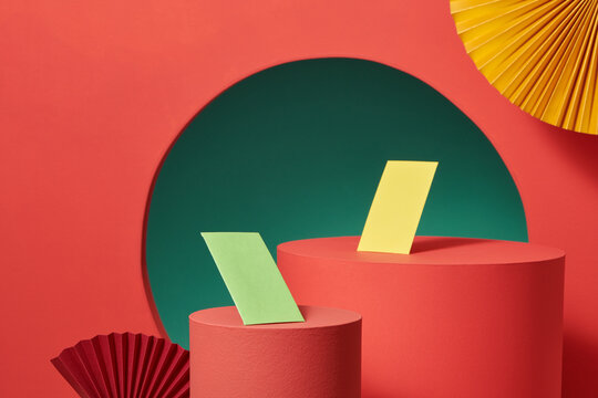 Folder paper, paper fans, and lucky money on the red background.