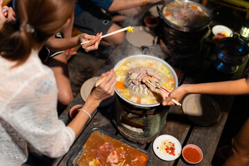 Group of Young Asian man and woman friends enjoy and fun celebration meeting dinner party eating...