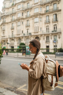 tourist woman walking through the streets of paris