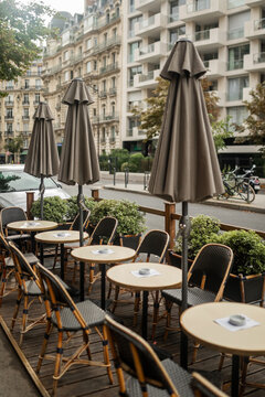 tables of a cafe on a street in Paris