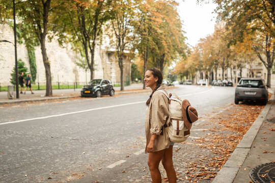 tourist woman walking through the streets of paris