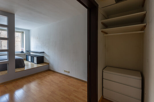 View from inside closet of integrated flat: drawers and shelves