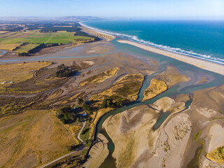 aerial panorama of ashley river mouth and waikuku beach in canterbury, south island, new zealand;...