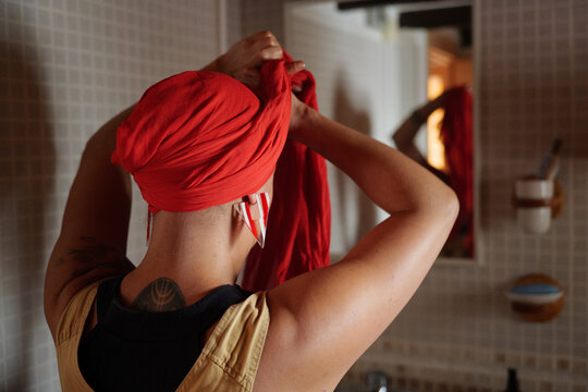 Anonymous cancer survivor woman Putting On headscarf