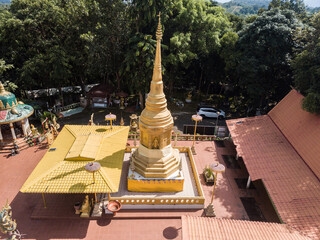 Aerial view of an iconic pagoda of Wat Phrathat Chom Muak Kaeo temple 1 in 9 most sacred temples in Chiang Rai province of Thailand.