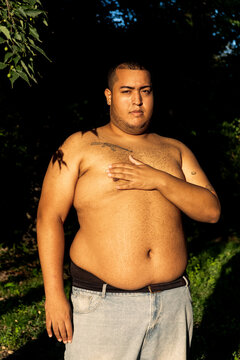 Portrait of a shirtless plus-size black boy