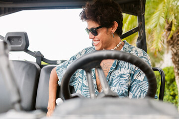 Man on his rented 4x4 car on adventure vacation