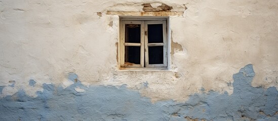 Old white window on a wall