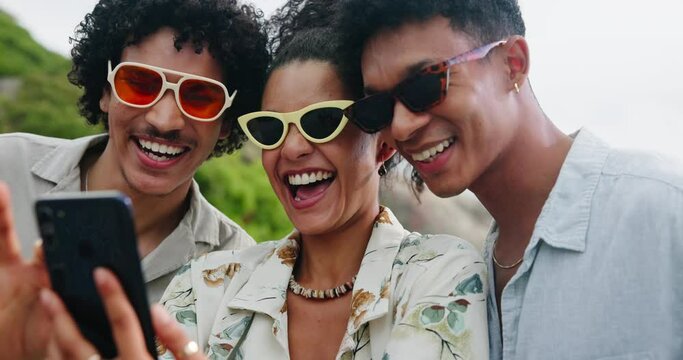 Friends, sunglasses and happiness outdoor with smartphone, selfie choice for social media post and laughing together. Shades, accessories and fashion with people and trendy eyewear for mobile app
