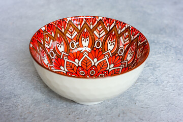 Empty Ceramic bowl with beauty motif pattern, close up.