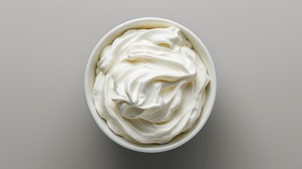 Top view of isolated bowl of sour cream or Greek yogurt. copy space for text. - obrazy, fototapety, plakaty