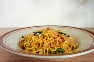 Indonesian fried noodle in a plate, ready to eat