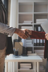 .Business handshake for teamwork of business merger and acquisition,successful negotiate,hand shake,two businessman shake hand with partner to celebration partnership and business deal concept