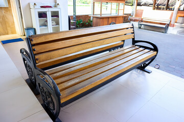 The elegance of wooden and metal long bench - obrazy, fototapety, plakaty