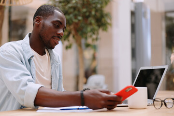 Naklejka premium Man adult african businessman computer technology sitting male person business laptop black working