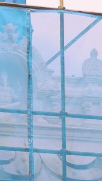 Restoration of an Indian temple. Restoration scaffolding. The temple is closed for restoration. Painting of the temple. The building is being painted.The building is undergoing facade restoration.
