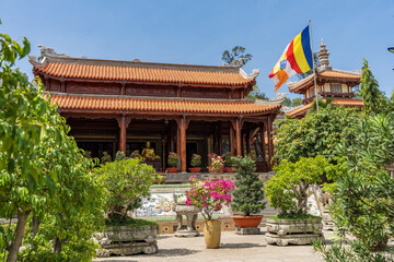A collection of bonsai plants in the forecourt of an ancient temple in Nha Trang in Vietnam - obrazy, fototapety, plakaty