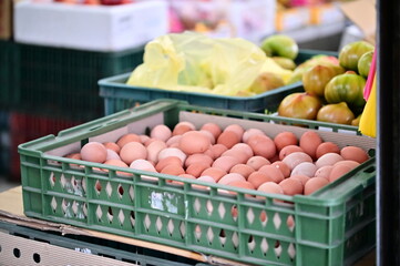 In Taiwan's markets, vegetable stalls offer fresh ingredients, including eggs, for daily consumption. These foods provide nutrition and help maintain health.