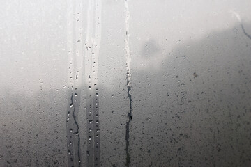 Water droplets from steam on the glass surface - 759478302