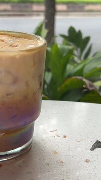 Vietnamese Egg Coffee. take two glasses of drink with your hand Choice of small or large mug Whipped yolks Top view a cup of Giang egg coffee. Vietnamese coffee. Eggs are beaten with coffee
