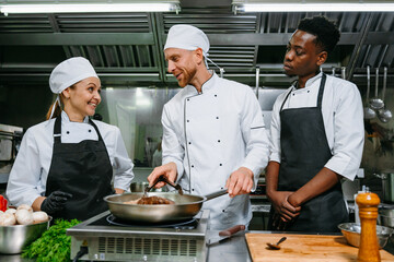 A team of chefs in a professional kitchen