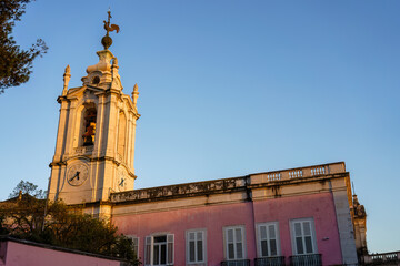 Bell tower of Capela de Nossa Senhora das Necessidades church in Lisbon, Portugal in the evening