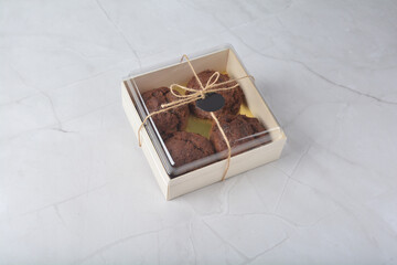 gourmet freshly bake golden Texas sweet chocolate chip honey biscuit cake scone milk butter bread in square bento wood box on white marble table rose gold fork knife pastry halal dessert vegan menu