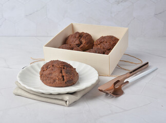 gourmet freshly bake golden Texas sweet chocolate chip honey biscuit cake scone milk butter bread in square bento wood box on white marble table rose gold fork knife pastry halal dessert vegan menu