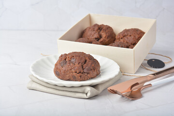 gourmet freshly bake golden Texas sweet chocolate chip honey biscuit cake scone milk butter bread in square bento wood box on white marble table rose gold fork knife pastry halal dessert vegan menu